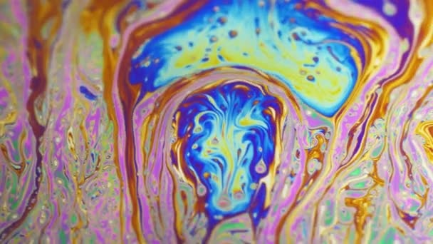 Psychedelic background of motion surface of colorful soap bubble — Stock Video