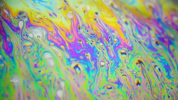 Psychedelic background of motion surface of colorful soap bubble — Stock Video