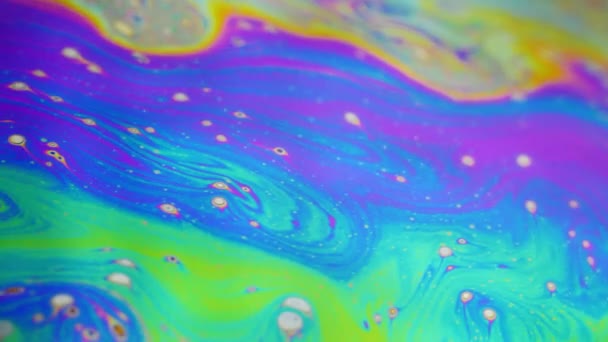 Psychedelic background of motion surface of colorful soap bubble — Stock Video
