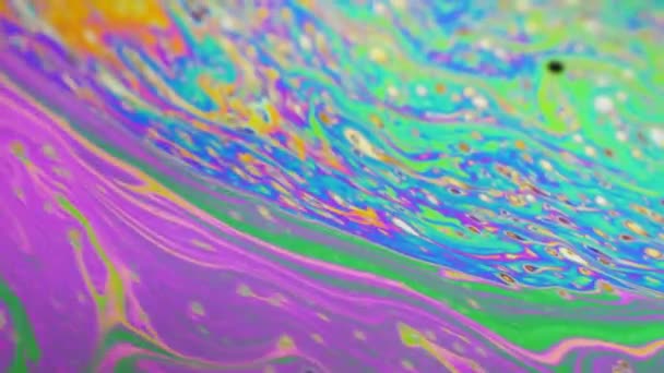 Psychedelic background of motion surface of colorful soap bubble — Stock Video