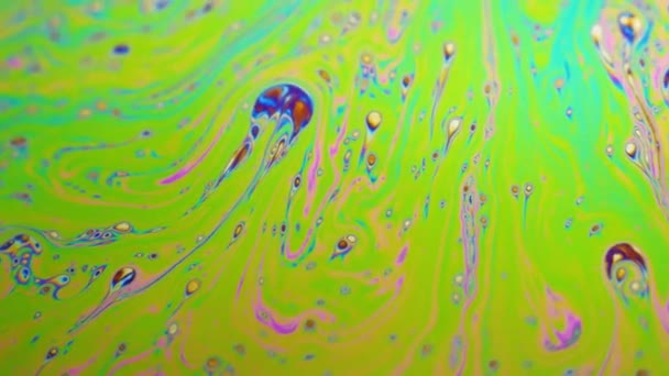 Psychedelic background of motion surface of colorful soap bubble — Stock Video