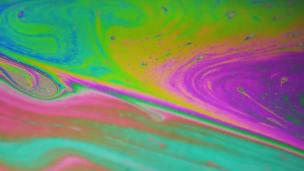 Fond psychédélique de surface de mouvement de bulle de savon coloré 