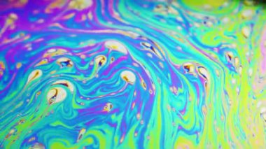 Renkli arka plan şaşırtıcı hareket çok renkli sabun köpüğü yüzeyinde oluşan