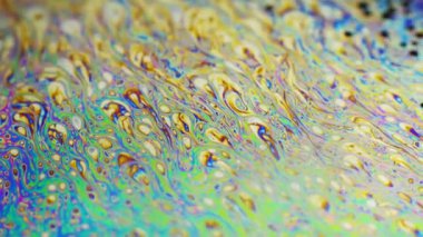 Renkli arka plan şaşırtıcı hareket çok renkli sabun köpüğü yüzeyine kurdu. Renk evren. Konsept sanat tasarımı. Çok renkli arka plan. Soyut desen.