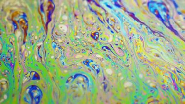 Renkli arka plan şaşırtıcı hareket çok renkli sabun köpüğü yüzeyinde oluşan