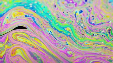 Renkli arka plan şaşırtıcı hareket çok renkli sabun köpüğü yüzeyinde oluşan