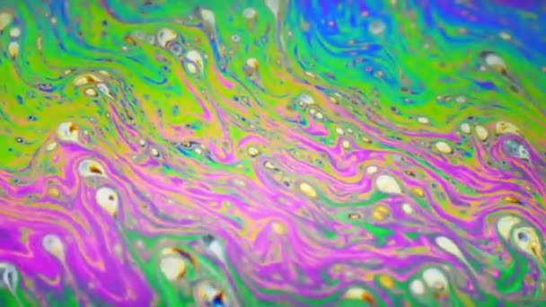 Amazing colorful background formed of motion multicolored surface of soap bubble — Stock Video