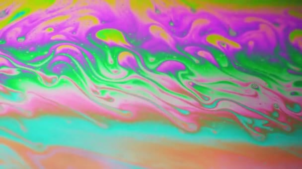 Amazing colorful background formed of motion multicolored surface of soap bubble — Stock Video