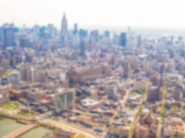 Defocused background with aerial view of skyscrapers in Manhattan, New York City, United States. Intentionally blurred post production for bokeh effect.