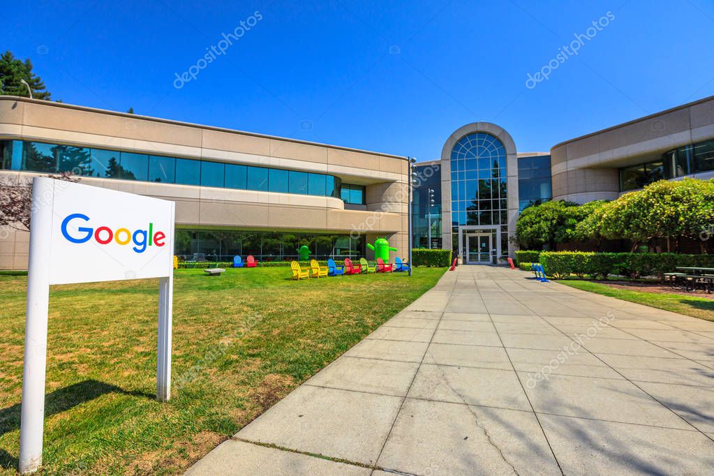 Mountain View, California, United States - August 13, 2018: Google Sign on 1625 Charleston road at Campus of Google HQ in Silicon Valley near Googleplex. Google android Nougat on background