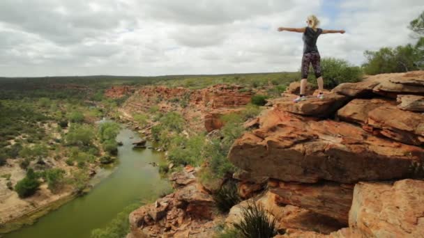 Happy Blonde Woman Open Arms Red Sandstone Rock Hawks Head — Stock Video