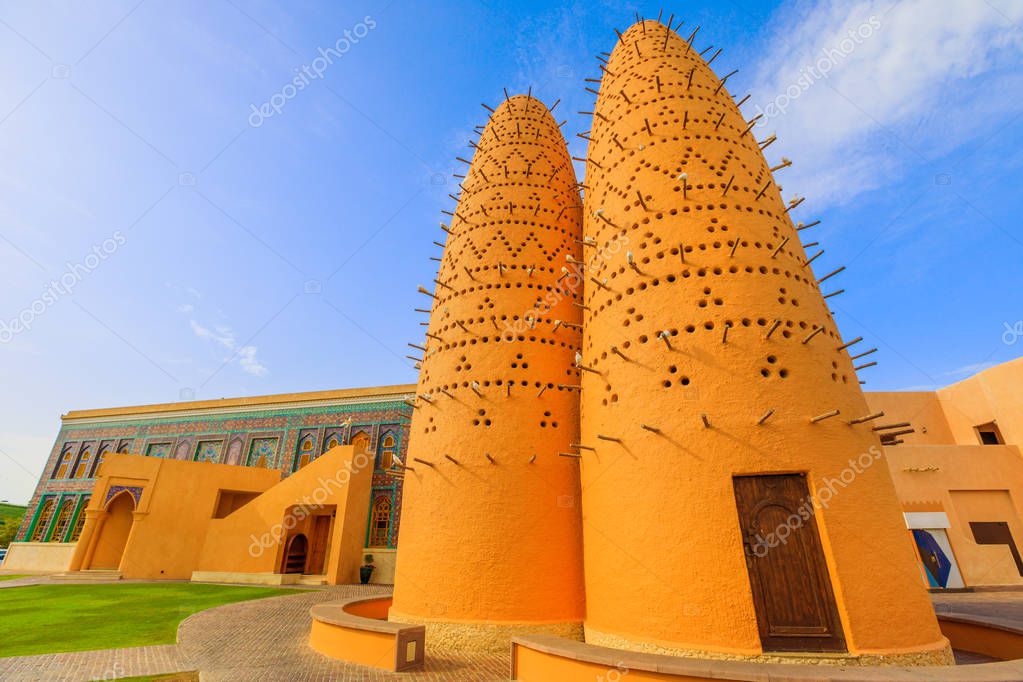 Mosque in Katara with famous pigeon towers. Katara is a cultural village also named valley of cultures in Doha, Qatar, located between West Bay and the Pearl. Middle East, Arabian Peninsula.