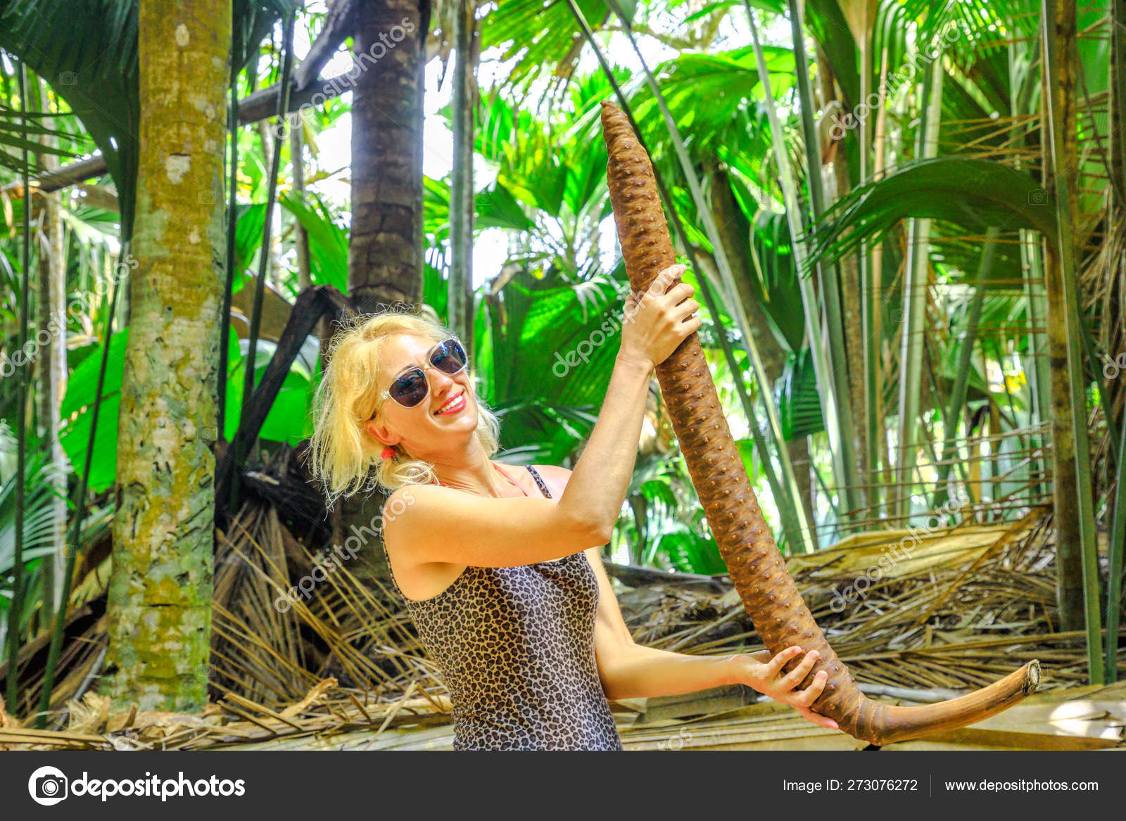 Woman with coco de mer male — Stock Photo © bennymarty #273076272