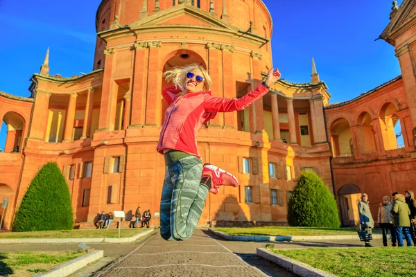 Woman jumping at San Luca — 스톡 사진