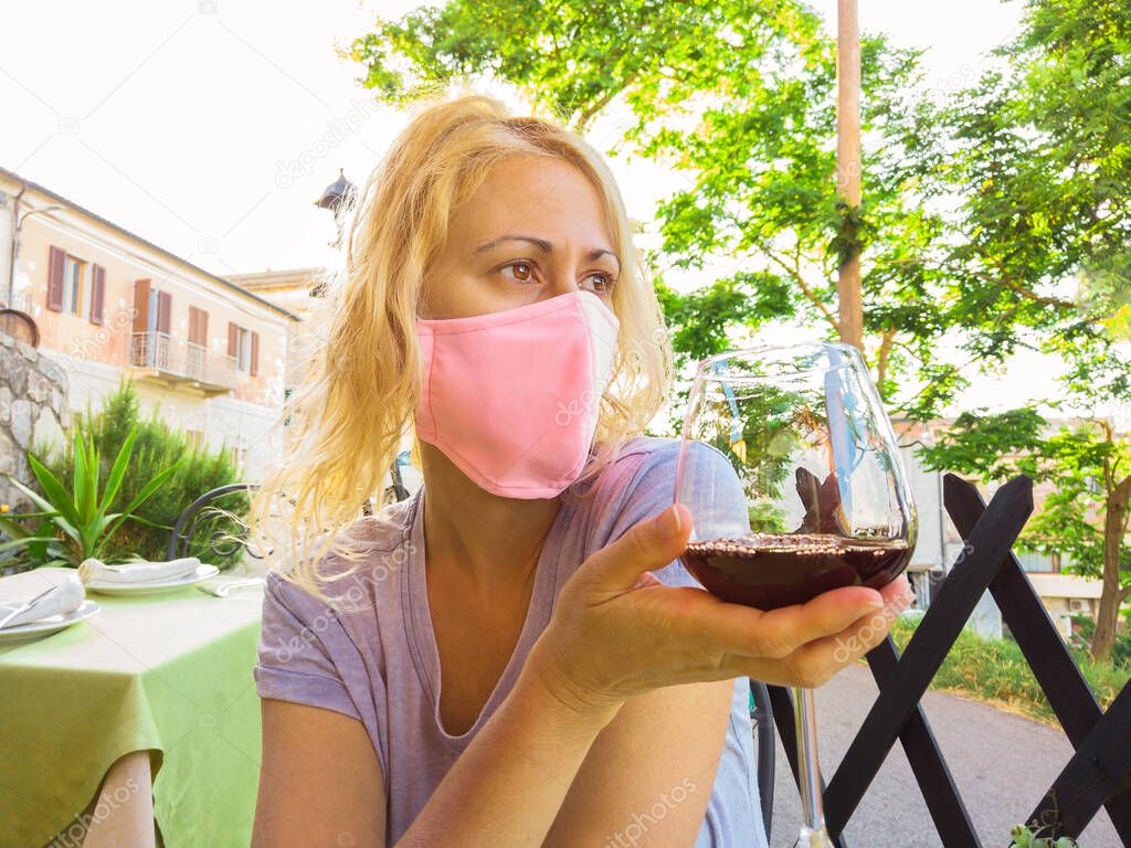 Wine shop with surgical mask in Elba