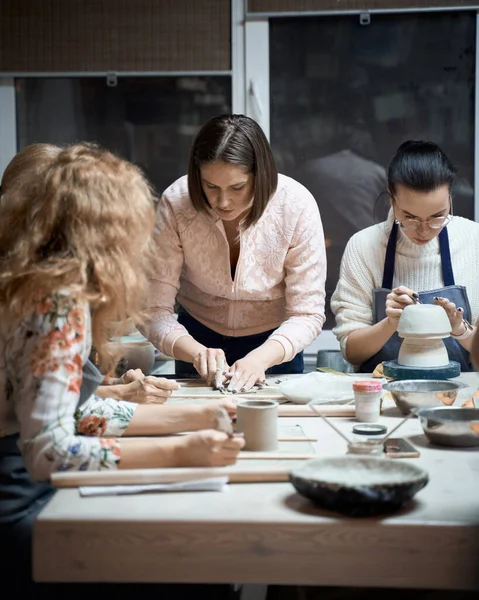 Woman making ceramic pottery on workshop. Concept for woman in freelance, business. Handcraft