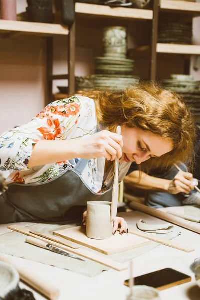 Woman making ceramic pottery. Concept for woman in freelance, business.