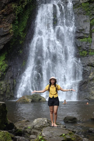 Women enjoying nature at Klong Lan waterfall in Klong Lan national park at Kamphaeng Phet, Thailand