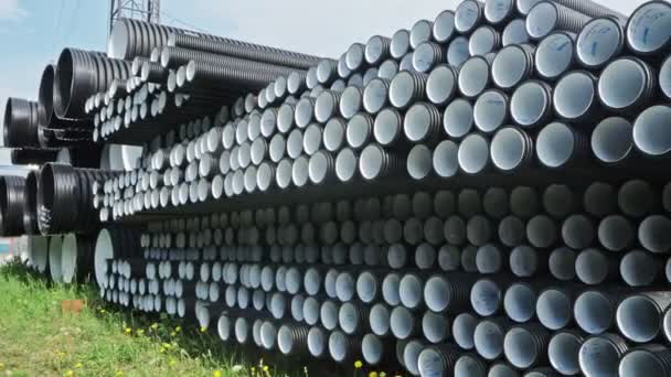 Warehouse of finished plastic pipes industrial outdoors storage site. Manufacture of plastic water pipes factory. — Stock Footage Warehouse of finished plastic pipes industrial outdoors storage site. Manufacture of plastic water pipes factory. Video Clip