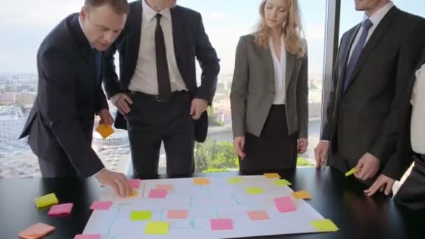 Business People Team Developing Plan Office Desk Using Stick Notes — Stock Video