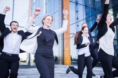 Happy running business people