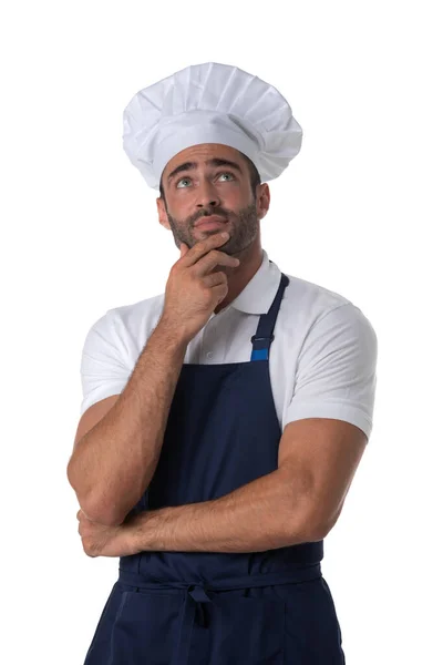 Retrato Cozinheiro Masculino Avental Chapéu Pensando Mãos Dadas Queixo Olhando — Fotografia de Stock