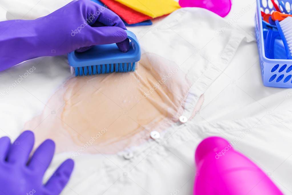 Clean the stain with a brush and detergent.
