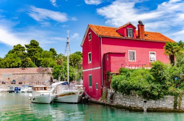 Boats and fishing boats on the pier in Fosa Bay in the spa town of Zadar in Croatia.