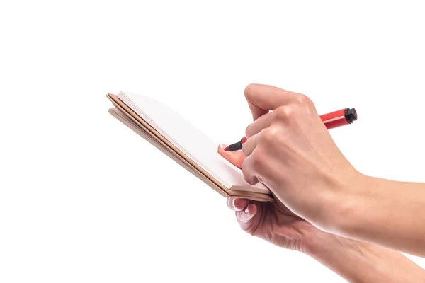 女性の手は、白い背景にノートとペンを保持します. — ストック写真