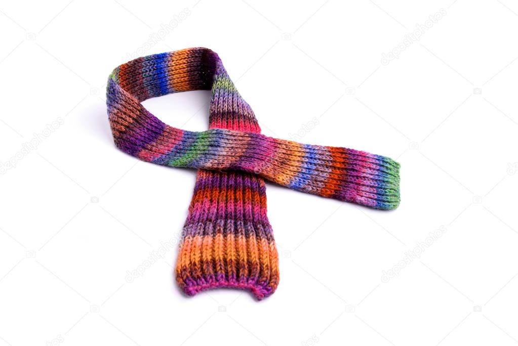 Winter multi-colored woolen scarf on white background.