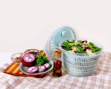 Centrifugal dryer for salad. Mechanical dryer for greens with spices, cabbage and seasonings. clipart