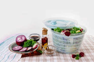 Centrifugal dryer for salad. Mechanical dryer for greens with spices, cabbage and seasonings. clipart