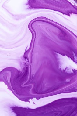 Abstract colored pink, violet and white acrylic paints. View of macro world through the microscope.