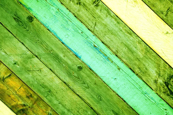 Background of Wooden boards of different colors. Green Wood material background for Vintage wallpaper.
