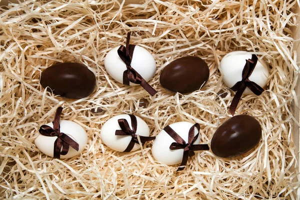 easter chocolate eggs box brown drawer wooden white straw splints yellow dutch bow ribbon holland