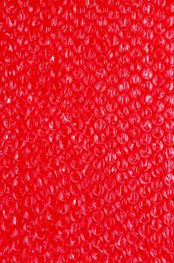 plastik arka plan doku selofan ambalaj ambalaj paketi boncuk topu kırmızı berry kan kanlı parlak renk