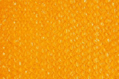 plastik arka plan doku selofan ambalaj ambalaj paketi boncuk topu parlak turuncu sarı sıcak güneş