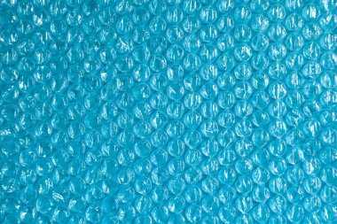 plastik arka plan doku selofan ambalaj ambalaj paketi boncuk topu parlak mavi gökyüzü çivit siyan rengi