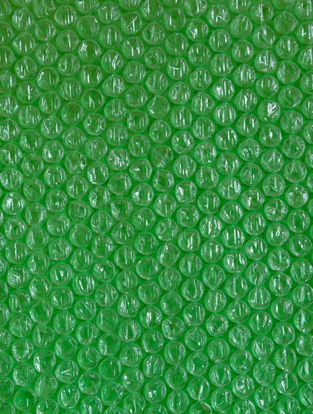 Plástico fundo textura celofane embalagem embalagem envoltório pacote talão bola verde verdes ufo trópico brilhante — Fotografia de Stock