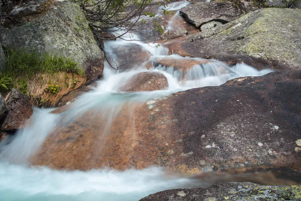 Mountain waterfall. Very beautiful landscape with mountain waterfall and pure mountain river