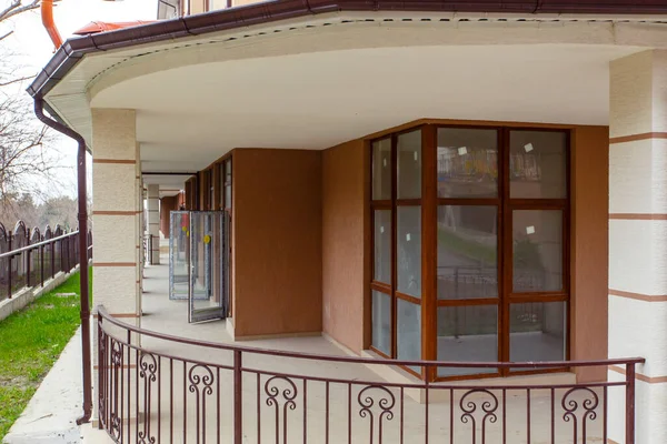 Terrace with commercial premises on the first floor of a new multi-storey residential building