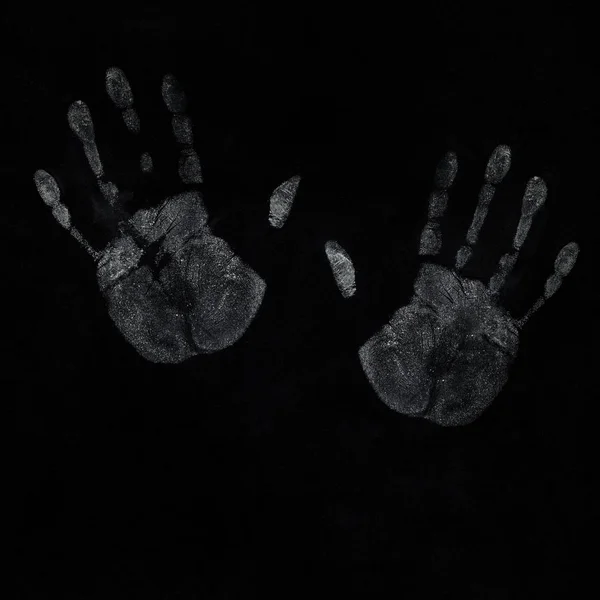 Бесшовный отпечаток руки на черном фоне — стоковое фото