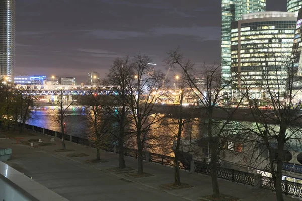 Moscow city skyscrapers in Moscow at night over the river