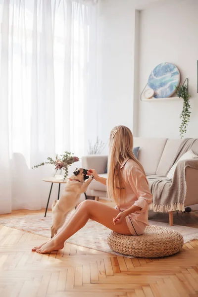 Lovely Girl Hugging Her Pug Playing Him House — Stock Photo, Image