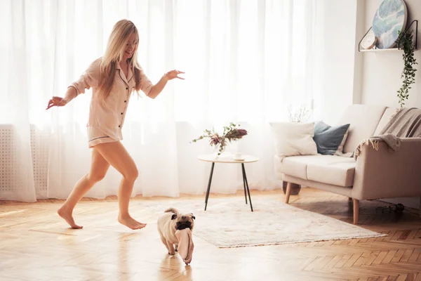 Lovely Girl Hugging Her Pug Playing Him House — Stock Photo, Image