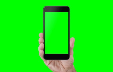 Yeşil, renk anahtarı izole ekran ve arka plan ile el gösteren telefon. Video editörleri için yakın çekim maket.