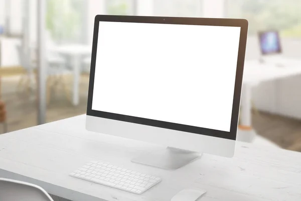 Modern computer display on white office desk. Isolated screen for mockup, app or web site design presentation. Office interior in background.