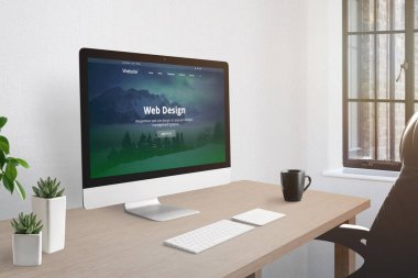 Web tasarım stüdyosu ofis kavramı. Masa üzerinde web sunumu ile bilgisayar ekranı. Klavye, kahve fincan, bitkiler yanında.