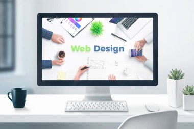 Web tasarım stüdyosu konsepti. Düz ofis masasında masaüstü bilgisayar ekranı. Close.