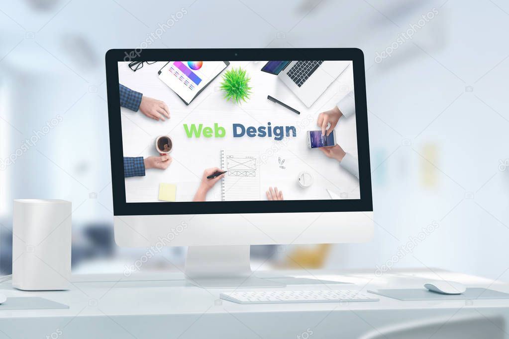 Web, app design studio concept with computer display and web design text. Concept of web team office.